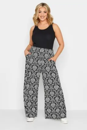 YOURS Curve Black Paisley Print Pull On Wide Leg Trousers